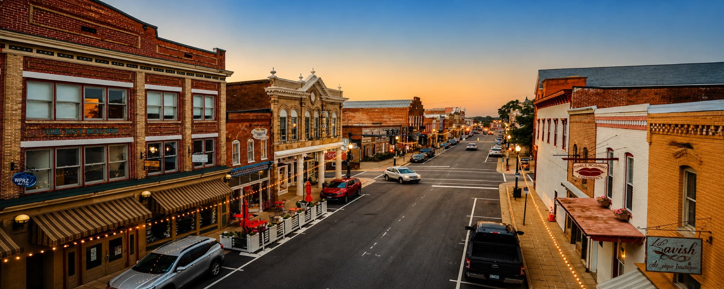 Historic downtown Culpeper, Virginia at golden hour, brick storefronts on East Davis Street